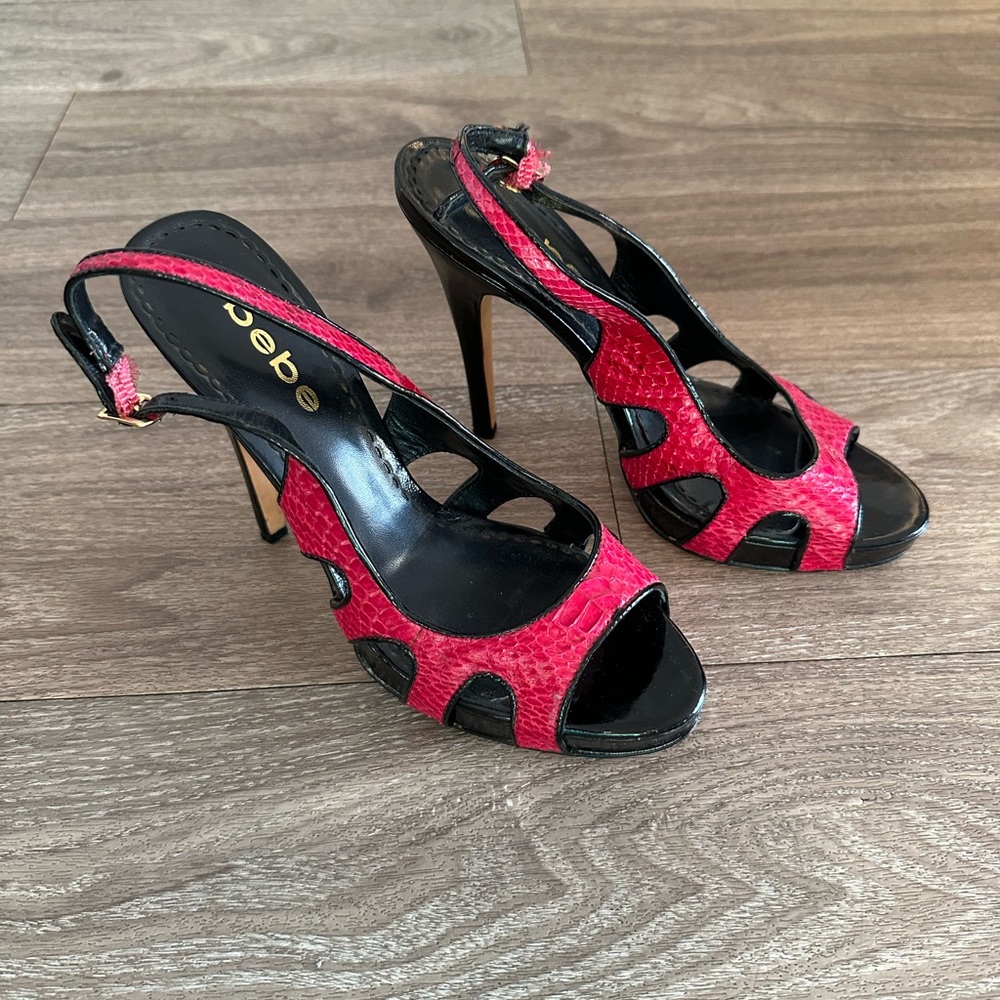 Bebe Pink snakeskin and patent leather open toe sling backs.
